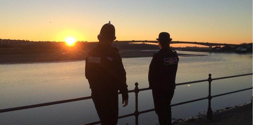 Two officers at sunset