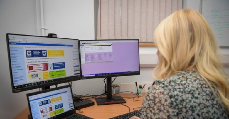 Police staff staring at monitors