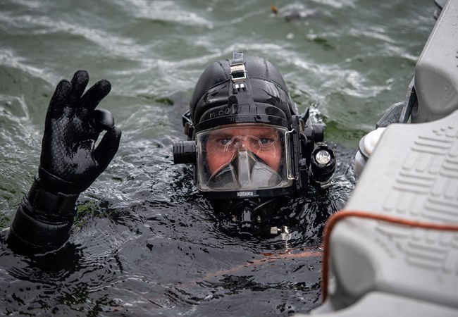 Male police diver in the water